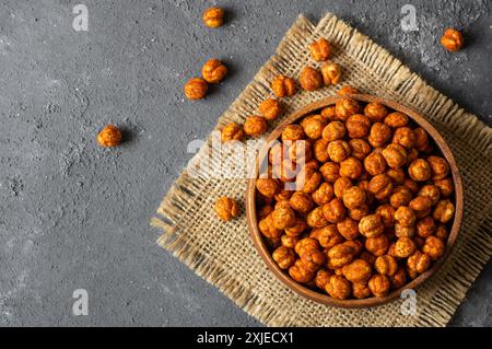 Roasted yellow chickpeas with chili pepper sauce, traditional spicy turkish nut, leblebi Stock Photo