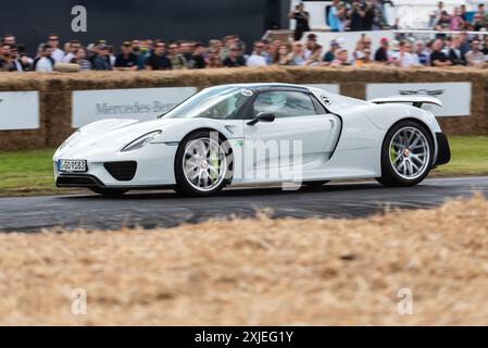 2014 Porsche 918 Spyder hybrid sports car driving up the hill climb track at the Goodwood Festival of Speed 2024 motorsport event, West Sussex, UK Stock Photo