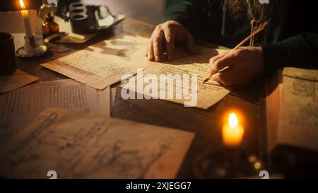 Close Up of Inscriptions and Notes With Hand of Old Renaissance Male Using Ink and Quill to Write New Ideas. Dedicated Historian Taking Notes, Inventing New Theories, Innovating Stock Photo