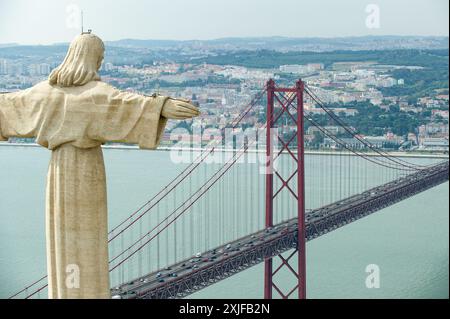 Aerial view of Sanctuary of Christ the King or Santuario de Cristo Rei on sunny summer day. Christ Statue in Lisbon. Stock Photo