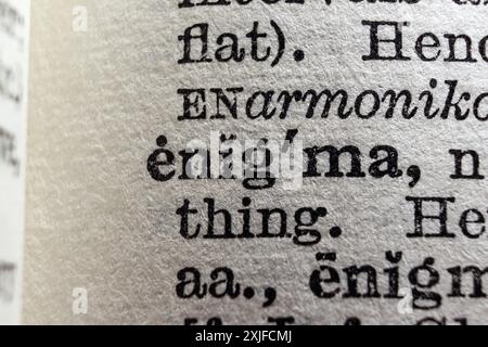 Word enigma on dictionary page, macro close-up Stock Photo