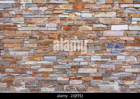 Colorful and textured stone brick wall - abstract graphic background Stock Photo