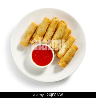 plate of fried spring rolls and sweet chili dip sauce isolated on white background, top view Stock Photo