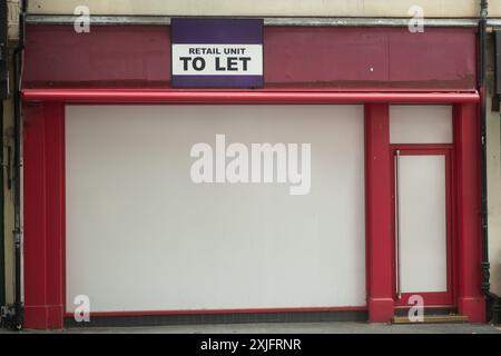 Tolet Shop Sign shop to let sign Stock Photo - Alamy