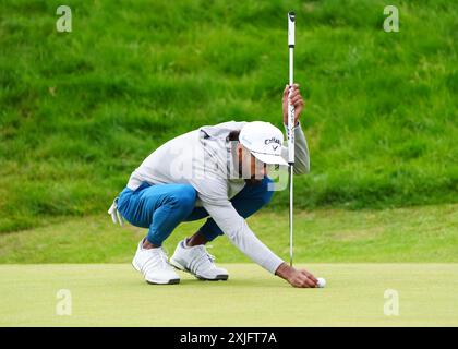 Akshay Bhatia lines up a putt on the seventh green during the second ...