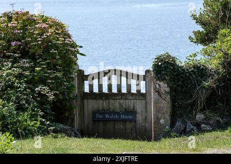 Around Coverack a fishing village with beach and harbour on the Lizard Peninsula Cornwall UK Gate to Lookout cottage Stock Photo