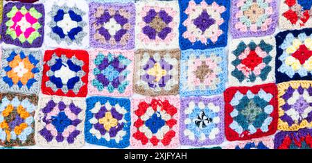 Multi colored blanket in wool, geometric background, retro decorative pattern Stock Photo
