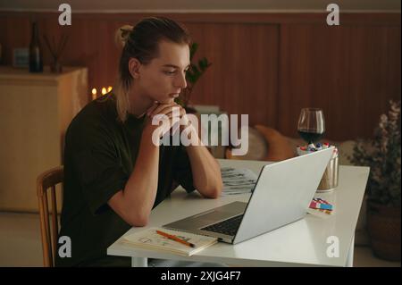 Graphic Designer Using Laptop At Work Stock Photo