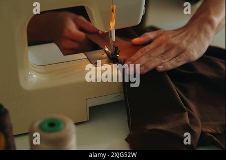 Tailor Using Sewing Machine At Work Stock Photo