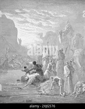 Wood Engraving of Moses Striking the Rock in Horeb Exodus 17:6 by Gustave Dore from 19th Century Holy Bible Stock Photo