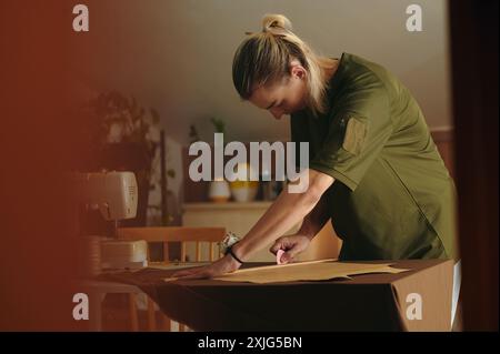 Fashion Designer Working In Workshop Stock Photo