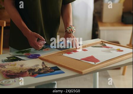 Designer Making Collage With New Collection Stock Photo