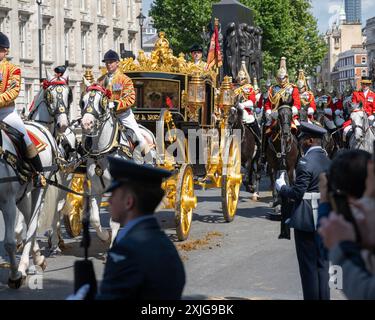 London, UK 17th Jul 2024. King Charles and Queen Camilla ride in the Diamond Jubilee State Coach along Whitehall for the State Opening of Parliament Stock Photo