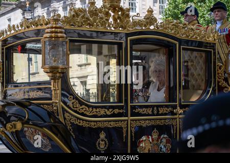 London, UK 17th Jul 2024. King Charles and Queen Camilla ride in the Diamond Jubilee State Coach along Whitehall for the State Opening of Parliament Stock Photo