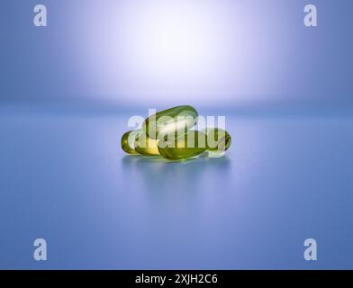 Omega-3 capsules in a pyramid shaped  pile on a white background. Stock Photo