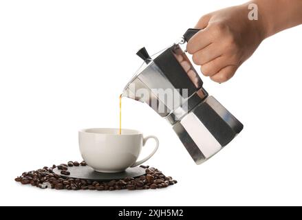 Woman pouring espresso from geyser coffee maker into cup on white background Stock Photo