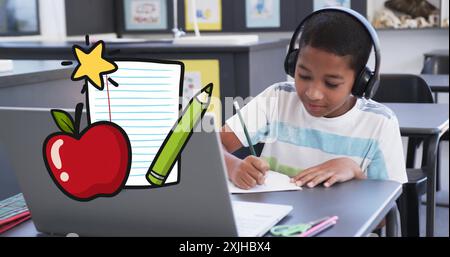 Studying at desk, child wearing headphones with school supplies image over scene Stock Photo