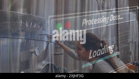 Processing data and loading image over woman working in industrial facility Stock Photo