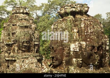 Stone towers carved with smiling face figures at Bayon temple in Angkor Thom, Siem Reap, Cambodia. Stock Photo