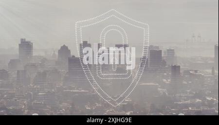Image of padlock and shield icon over modern cityscape. Network, data, security, digital interface, connection, business and communication, digitally Stock Photo