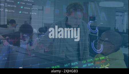 Image of charts and data processing over diverse male colleagues discussing at computer. Digital interface, teamwork, business, office, network and co Stock Photo
