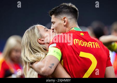 Berlin, Germany. 14th July, 2024. Alvaro Morata (R) of Spain kisses his wife Alice Campello-Morata (L) during the ceremony after the UEFA EURO 2024 final match between Spain and England at Olympiastadion Berlin. Final score: Spain 2:1 England. Credit: SOPA Images Limited/Alamy Live News Stock Photo