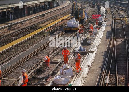 London, UK. 19 July 2024 . Rail maintenance workers  at Clapham Junction. The  new Labour government has introduced  draft legislation under it's manifest to renationalise the UK  rail services, most which are privately owned. and  to bring rail passenger services back into public ownership . The legislation will bring rail operators into public ownership when the private companies' contracts expire and  will be managed by 'Great British Railways .Credit: Amer Ghazzal/Alamy Live News Stock Photo