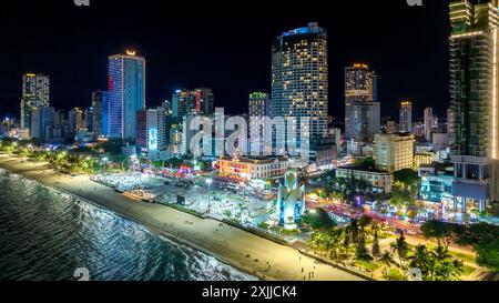 Aerial view of the coastal city of Nha Trang seen from above at night. This is a famous city for cultural tourism in Nha Trang, Vietnam Stock Photo