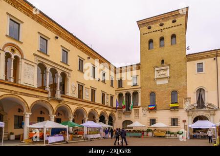 Crema, Italy - February 26 2023: Carnival market scene in the Cathedral (Duomo) square, with locals and visitors, in Crema, Lombardy, Northern Italy Stock Photo