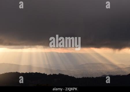 View of sunset light rays after rain over valley of Oaxaca, MÃ©xico Stock Photo