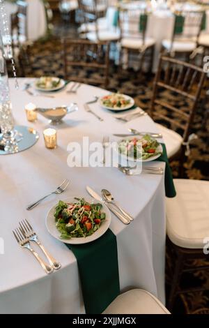 salads and table settings at dinner party reception event Stock Photo
