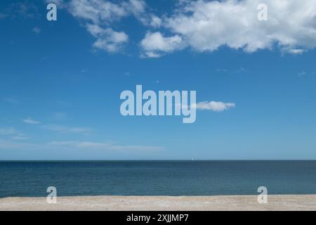 A clear blue sky with a few clouds Stock Photo