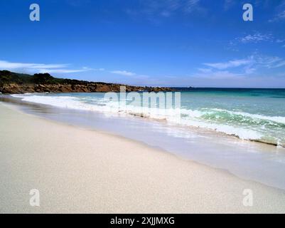 The glorious vista of Smiths Beach in Western Australia on a bright sunny day complete with a deep blue sky, azure sea and white sand. Stock Photo