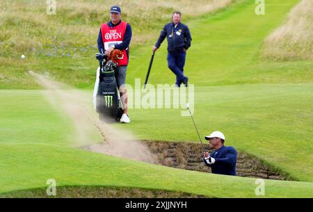 USA's Tiger Woods chips out of a bunker on the 5th during day two of The Open at Royal Troon, South Ayrshire, Scotland. Picture date: Friday July 19, 2024. Stock Photo