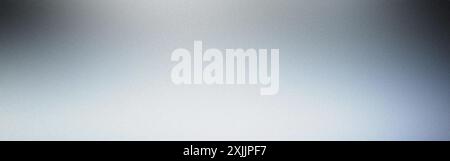 Silver gradient background with overhead lighting and a textured grainy effect Stock Photo