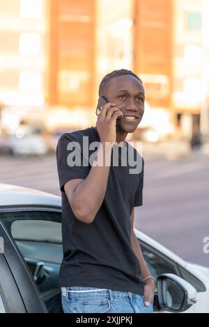 young black man talking on his smartphone Stock Photo