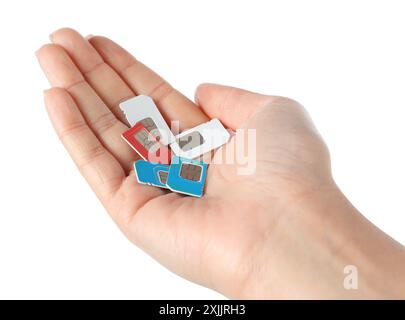 Woman with SIM cards on white background, closeup Stock Photo