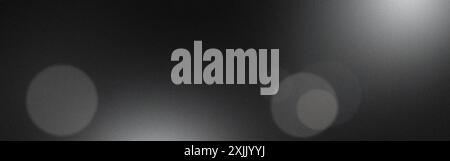 Grainy black and white background with blurred lights effect Stock Photo