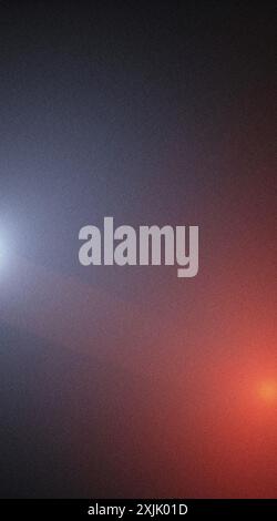 Grainy texture abstract background transitioning from blue to orange Stock Photo