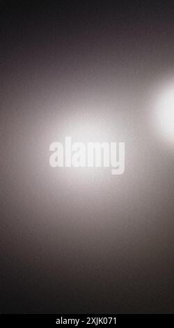 Dark gray abstract background with light speckles and grainy texture Stock Photo