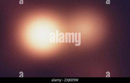 Two lights are shining on a grainy textured background Stock Photo