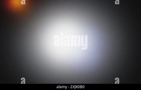 Grainy textured abstract background with a bright center and vibrant orange spotlights Stock Photo