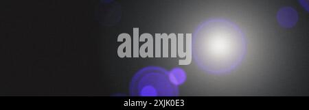 Abstract background with bright light shining on black background with lens flare Stock Photo