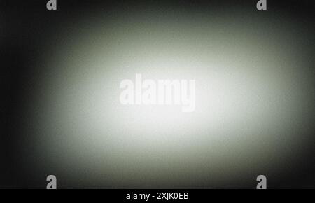Dark vignette with subtle grain texture creating an abstract background around a bright center Stock Photo