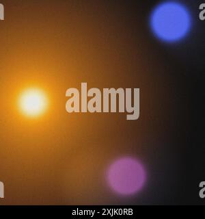 Abstract background with grainy texture and blurred lights creating a warm atmosphere Stock Photo