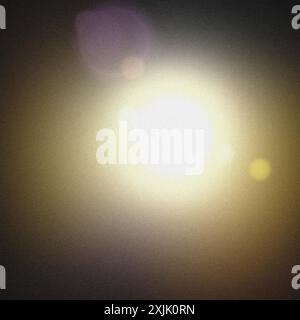 Bright light shining on a grainy texture background Stock Photo