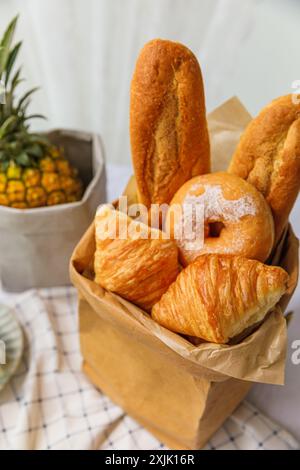 Basket of freshly baked buns on a table in a bakery Stock Photo
