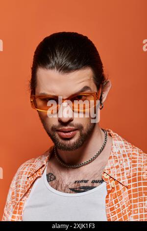 Handsome man with beard wearing trendy sunglasses. Stock Photo