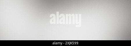 Abstract silver background with a light beam shining downwards, creating a grainy texture Stock Photo