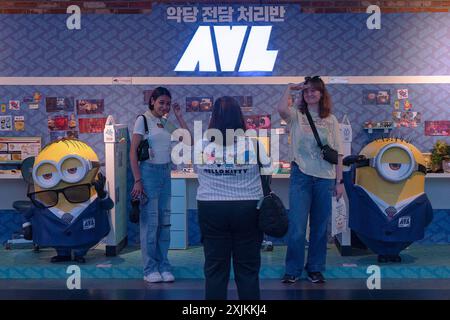 Seoul, South Korea. 19th July, 2024. People seen posing for a photo in front of the movie 'Despicable Me 4' in Seoul which will be released on July 24th in South Korea. 'Despicable Me 4' is released in South Korea. Credit: SOPA Images Limited/Alamy Live News Stock Photo